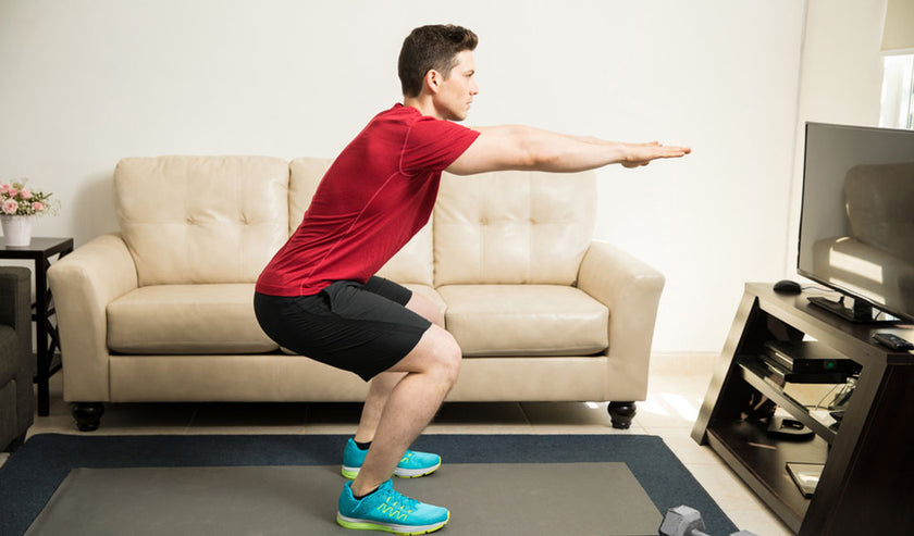 man doing squats man doing squats